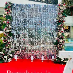 Another view of the silver sequin wall for the 75th birthday party. The sequin panels move with the breeze, creating a dynamic and sparkling effect that looks fantastic in photos and videos.