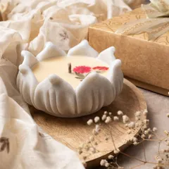 I love the elegance of these marble urli candles. Each one is carved from real Indian marble and filled with scented wax, with delicate pressed flowers on top for a beautiful, lasting gift.