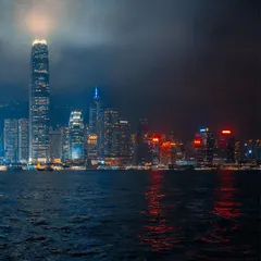 The iconic Hong Kong skyline at night, with neon lights reflecting on the water. There's a special kind of magic in a city's glow after dark.