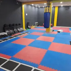 Our matted training floor is connected to the gym, allowing for a seamless transition between martial arts drills and fitness training.