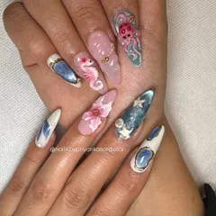 A full view of the vacation-ready 3D ocean set. Each nail is a different underwater scene, featuring hand-sculpted seahorses, octopuses, shells, and florals for a truly unique and artistic manicure.