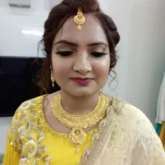 A closer view of the anniversary makeup. We chose a soft gold shimmer on the eyes to match her jewelry and a warm berry lip color that brightened her entire face.