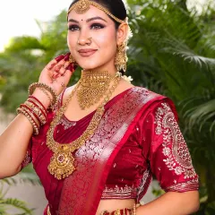 A beautiful pose showing the intricate details of the bride's henna and jewellery. The makeup is designed to harmonize with these elements, creating a cohesive and stunning bridal look.