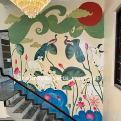 I love bringing our heritage to life on a grand scale. This expansive Pichwai mural flows up a staircase, filling the home with traditional elegance, featuring sacred cows, peacocks, and lotus ponds. Each element is hand-painted to tell a story of culture and beauty.