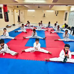 Flexibility is key to powerful kicks. Our students work on their splits and other stretches daily to improve their range of motion.