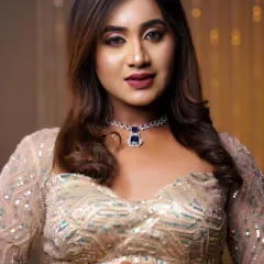 A close-up of a modern party hairstyle with soft curls and side-swept bangs. This style frames the face beautifully and is perfect for a glamorous evening event.