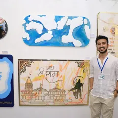 Here I am at my exhibition, standing with some of my favorite pieces, including the Ram Mandir panel and the conceptual Mumbai map. It was an incredible experience to share my work with so many people.