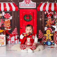 A little one enjoying a candy prop during our delightful and imaginative Candy Land photoshoot.