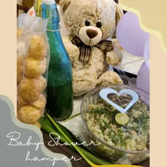 A delightful baby shower hamper designed to pamper the parents-to-be, including a fun Pani Puri set and an adorable teddy bear.