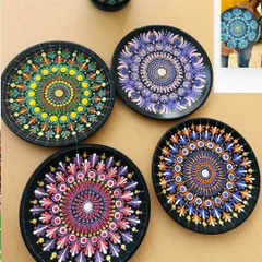 A collection of stunning dot Mandala plates created in my workshop. The symmetry and colors are so calming to look at.