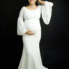 Another beautiful pose from the same solo session, showing how we can capture a variety of looks and moods. The mother-to-be gently touches her hair, looking serene and confident.
