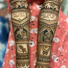 A very traditional and auspicious design featuring elephant motifs, Sanskrit shlokas, swastikas, and symbols of prosperity like kalash and Ganesha.