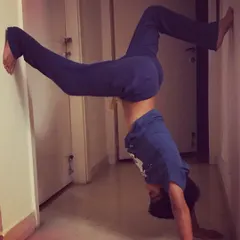 Learning to go upside down with the help of a wall. This supported handstand is a safe way for kids to build upper body strength and experience a new perspective.