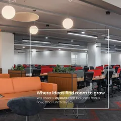 A successful office layout balances focus, flow, and functionality. This view shows a mix of open workstations with pops of color and a nearby lounge area, providing employees with choices for how and where they work.