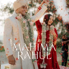 The Varmala moment. A shower of flower petals rains down on the couple as they celebrate the beginning of their life together. This is a shot filled with pure joy.