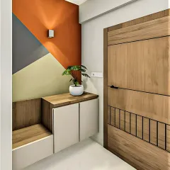 A modern and artistic entryway featuring a floating cabinet and an attached bench. The geometric color-blocked accent wall adds a vibrant and playful touch to this functional space.