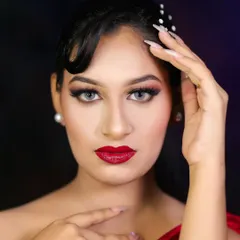 Another portrait of the classic glamour look, showing the elegant hairstyle with pearl accessories.