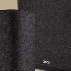This close-up shows the premium fabric and build quality of a Denon Home wireless speaker. We select audio components that deliver exceptional sound performance while also complementing your home's interior design.