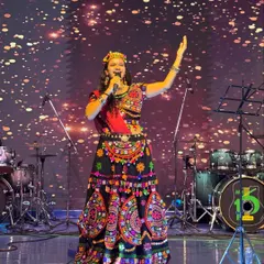 Hosting a Navratri festival is all about channeling divine energy. On stage, I combine my performance with the vibrant traditions of Garba, ensuring the entire crowd feels the festive spirit.