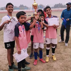 Victory for the Under-13 squad. Holding their certificates and trophy, these players showcase the success that comes from dedication and playing as a single unit.