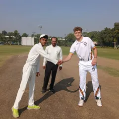 We provide our trainees with international exposure by hosting teams from other countries. This image shows the captains' handshake before a competitive match against the U-16 team from South Africa, fostering sportsmanship and global experience.