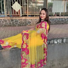 This yellow saree with a pink border is perfect for festivals like Karwa Chauth or for a pre-wedding shoot.
