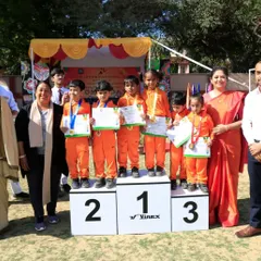 Celebrating the winners. Presenting medals to young athletes is a reminder that recognizing effort is just as important as celebrating victory. It builds the foundation for a lifetime of achievement.