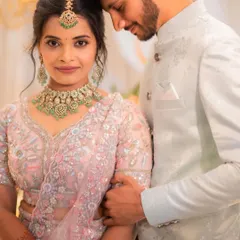 A perfect couple, ready for their engagement. I created a soft, romantic makeup look with a messy updo to complement her delicate pastel lehenga, ensuring she looked effortlessly elegant.