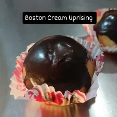 The Boston Cream Uprising is here. My baked version of the classic features a soft bombolini filled with a velvety vanilla custard and topped with a glossy chocolate glaze.