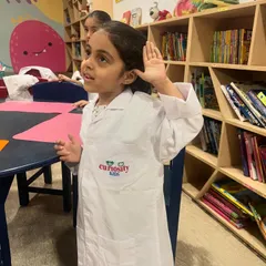 A young student listens intently during our science camp. We aim to spark curiosity and a lifelong love for learning in every child.