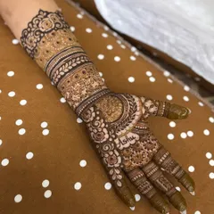 This engagement henna features a full arm of detail but with a slightly more open feel than a heavy bridal design. The personalized name makes it extra special.