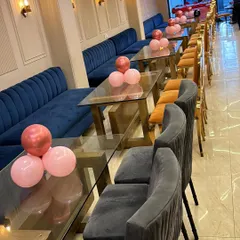 A simple yet elegant setup for an anniversary celebration in a restaurant. I placed small clusters of pink and rose gold balloons on the tables to add a festive touch without cluttering the space.