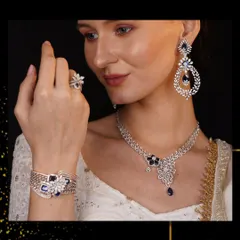 A symphony in sapphire and diamonds. This complete ceremonial set, featuring a necklace, bracelet, earrings, and ring, is designed for grand occasions. The deep blue of the sapphires provides a stunning contrast to the sparkle of the diamonds.