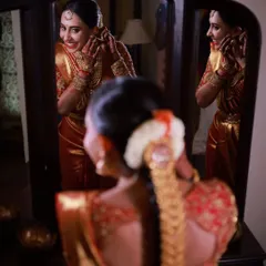 A beautiful reflection of the bride as she gets ready. These quiet, happy moments before the ceremony are just as important as the main event.