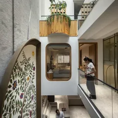 In the Slender House, the main brief was to maintain connection between family members. I designed an inward-looking structure with spaces interconnected via a central, light-filled courtyard, as seen in this view from the upper level.