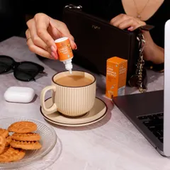This lifestyle photo shows Sprig's Chai Masala Extract in a natural, everyday work setting. My goal here is to place the product directly into the customer's life, making it feel both aspirational and essential for their daily routine.