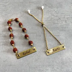 A perfect Rakhi pair for your brother and sister-in-law (Bhaiya-Bhabhi). We have a Rudraksha rakhi for him and a matching Lumba for her, both with personalized nameplates.