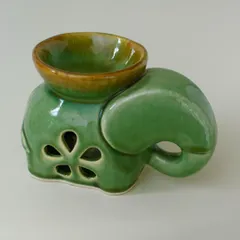 This adorable ceramic elephant oil burner is perfect for bringing spa vibes into your home. The top bowl holds water and essential oils, while a tealight inside gently warms it, releasing a soothing aroma.