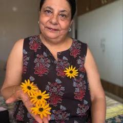 A closer look at my handmade crochet sunflower brooches. These bright yellow flowers can instantly freshen up any outfit.