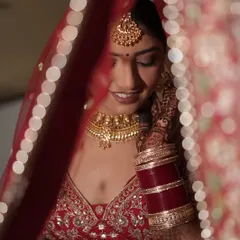 A classic bridal portrait of Bhawna. I love this shot through the dupatta, which highlights the soft smokey eye and the rich color of her lipstick.