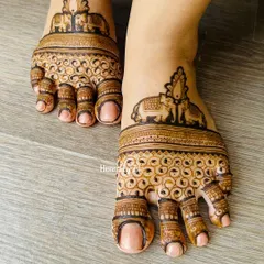 Don't forget the feet! I love creating adorable and elegant foot mehendi, like this symmetrical design featuring majestic elephants, to complete your bridal look from head to toe.