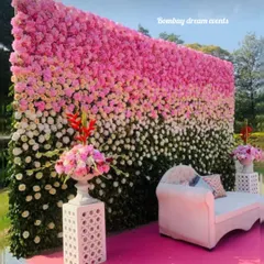 A beautiful ombre flower wall made of fresh pink, white, and green florals. This makes a luxurious backdrop for a baby shower, engagement, or reception.