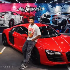Bringing the heat to this Ahmedabad showroom with a 'Most Wanted' themed mural. This piece features a custom Nissan GTR and BMW M2, hand-painted to match the high-energy vibe of the space and the supercars it houses.