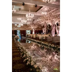 For this event, I designed a grand entrance with a fully mirrored aisle reflecting elegant, blossoming cherry trees and crystal chandeliers. This level of detail creates a luxurious and impressive experience for guests from the moment they arrive.
