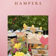A beautiful display of our hampers, ready for a special event. We combine our food items with fresh flowers and thoughtful packaging to create a memorable gift.
