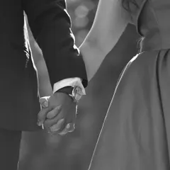 A classic black and white photo of a couple holding hands. This timeless style emphasizes the emotion and connection, proving that sometimes the simplest gestures are the most powerful.