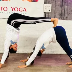 A creative and challenging partner pose, forming a double Downward-Facing Dog. This not only builds strength and balance but also requires great communication and teamwork.