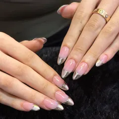 Taking the classic French manicure to the next level. This look features a clean, natural pink base on long, almond-shaped nails, but with a futuristic twist: a flawless, mirror-like silver chrome tip. It's sophisticated with a modern edge.