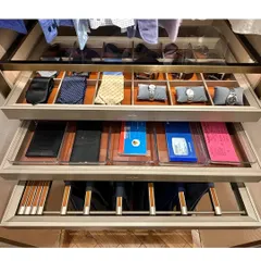 A closer look at our custom drawer organization for men's accessories. We designed specific sections for ties, watches, and wallets, ensuring these valuable items are kept safe and orderly.