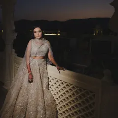 A magical sangeet night look. The dramatic smokey eye and glowing skin stand out beautifully against the evening sky, making my bride Shreya look absolutely ethereal in her shimmering lehenga.